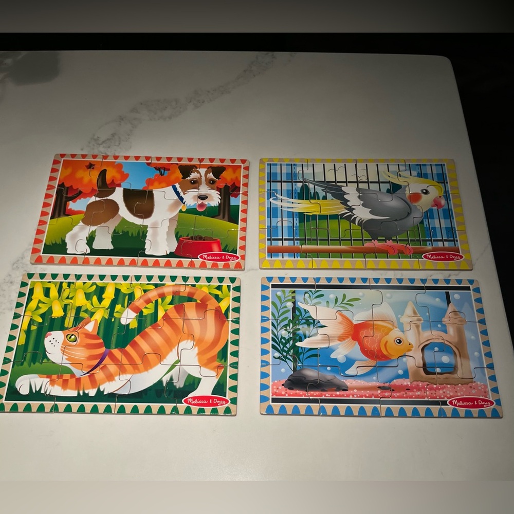 2 sets of Melissa & Doug wooden puzzles. 4 pet puzzles & 4 dinosaur puzzles